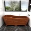 Teak wood carved bathtub, durable, water-resistant, and luxurious—perfect as a statement piece for unique, nature-inspired bathrooms.
