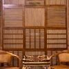 Innovative wooden wall panel with slatted and upholstered sides for decoration and acoustic benefits, perfect for modern interiors.