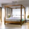 Minimalist Canopied Bed with Rattan Warmth