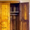 The Tropicwood 4-Door Wardrobe: Crafted Warmth and Breezy Elegance