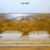 Timeless Wooden Bed with Carved Elegance