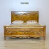 Timeless Wooden Bed with Carved Elegance