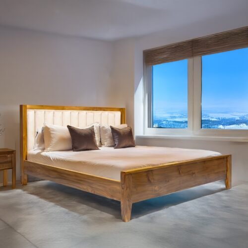 The Elegant Fabric Accent Bed combines solid teak wood, light fabric headboard, and satin finish for timeless bedroom comfort and refined elegance.