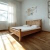 The Minimalist Solid Wooden Bed features solid teak wood, a soft touch headboard, and a natural satin finish for timeless bedroom elegance.