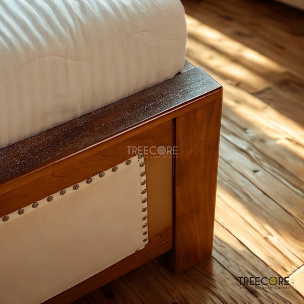 The Rattan Wooden Bed combines teak wood strength, woven rattan texture, and a soft headboard with satin finish for elegant comfort.