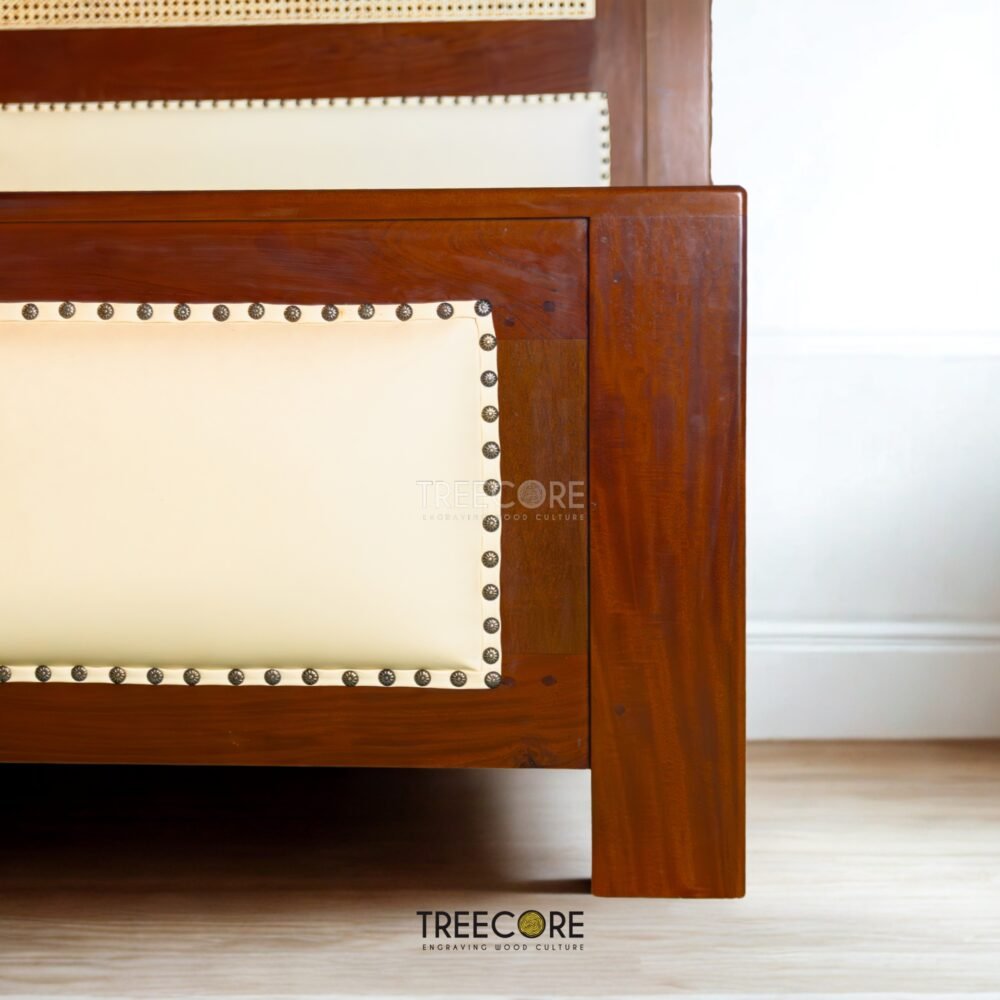 The Rattan Wooden Bed combines teak wood strength, woven rattan texture, and a soft headboard with satin finish for elegant comfort.