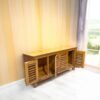 The Slatted Door Buffet, crafted from solid teak wood with satin finish, offers elegant storage with timeless design and practical functionality.