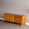 The Clean Line Wooden Sideboard, crafted from solid teak with satin finish, offers versatile drawers and elegant clean-line design for timeless interiors.