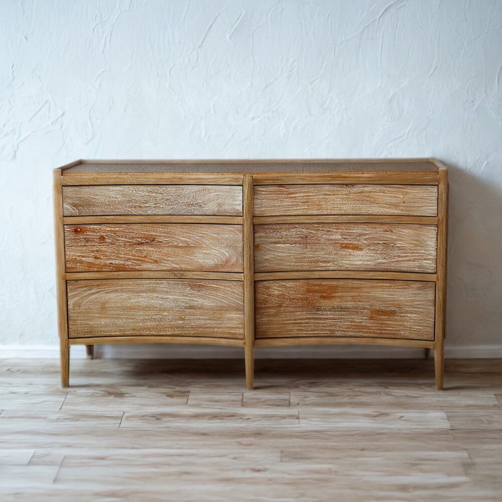 The Rustic Farmhouse Style Sideboard features teak wood, woven rattan surface, and six drawers, combining rustic charm with functional storage solutions.