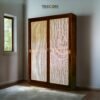 The Artisan Woven Rattan Sliding Wardrobe combines teak wood strength and rattan charm with satin finish for timeless, functional elegance.