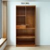 The Open Wardrobe with Drawer, made of teak wood with satin finish, offers stylish open storage and practical drawer functionality.