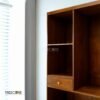 The Open Wardrobe with Drawer, made of teak wood with satin finish, offers stylish open storage and practical drawer functionality.