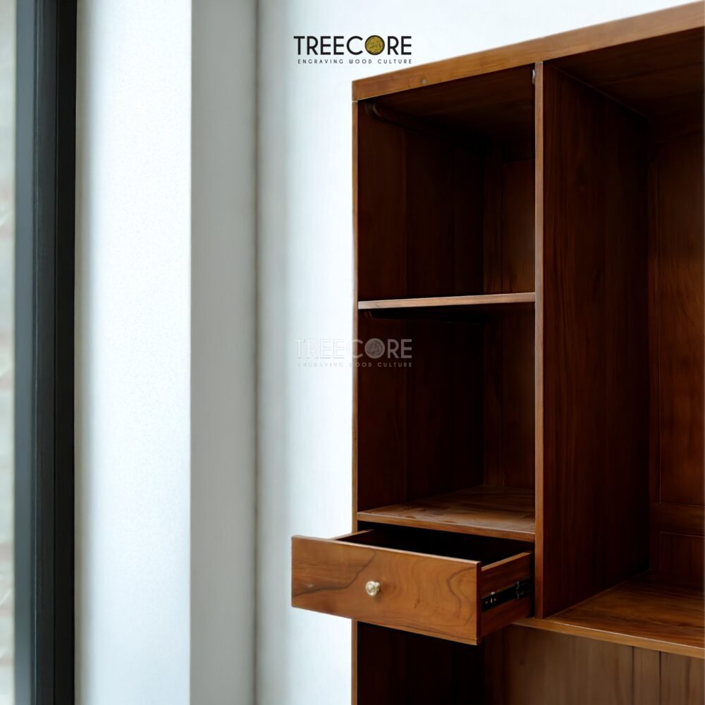 The Open Wardrobe with Drawer, made of teak wood with satin finish, offers stylish open storage and practical drawer functionality.