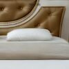 Elevate your bedroom with the Royal Gold Wooden Bed crafted from mahogany wood with pearl finish and genuine gold leaf detailing.