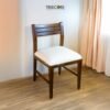 Upgrade your workspace with the Minimalist Design Study Chair, crafted from teak wood with a cushioned seater and elegant satin finish.