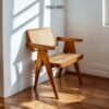 Enhance your dining space with the Natural Rattan Dining Chair, featuring a teak wood frame, woven rattan seating, and satin finish.