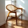 Experience comfort and style with the Scandinavian Rattan Dining Chair, featuring teak wood frame, rattan backrest, soft foam cushions, and satin finish.