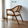 Experience comfort and style with the Scandinavian Rattan Dining Chair, featuring teak wood frame, rattan backrest, soft foam cushions, and satin finish.