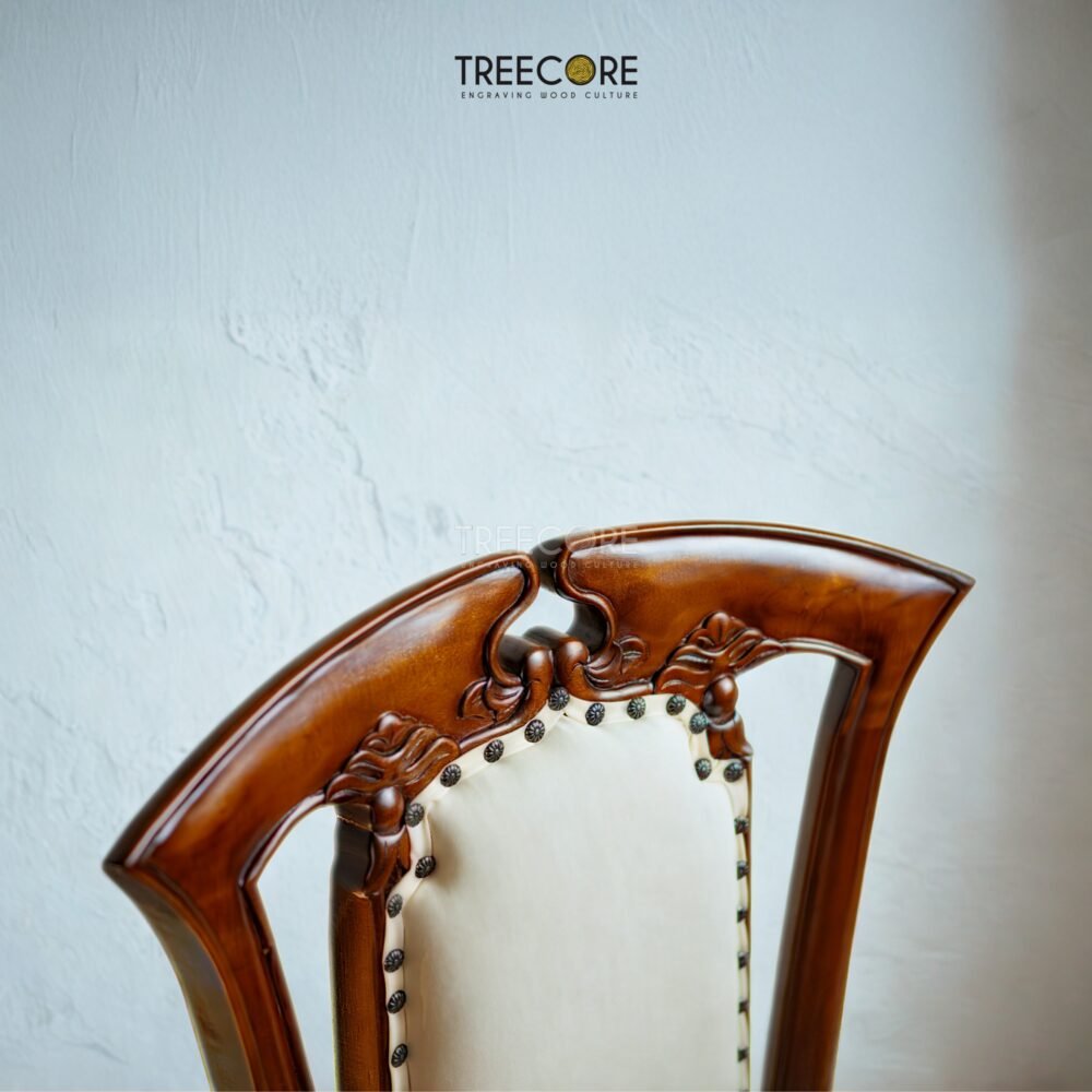 Enhance interiors with the Wooden Carving Sofa Chair, crafted from teak wood with detailed carvings and soft foam cushioning for comfort.