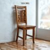 Bring artistic charm to your home with the Unique Mosaic Patterned Wood Chair, crafted from teak wood with a natural satin finish.