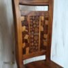 Bring artistic charm to your home with the Unique Mosaic Patterned Wood Chair, crafted from teak wood with a natural satin finish.