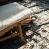 Experience timeless comfort with the Curved Rattan Lounge Chair, crafted from teak wood with natural satin finish and plush soft cushions.