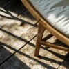 Experience timeless comfort with the Curved Rattan Lounge Chair, crafted from teak wood with natural satin finish and plush soft cushions.