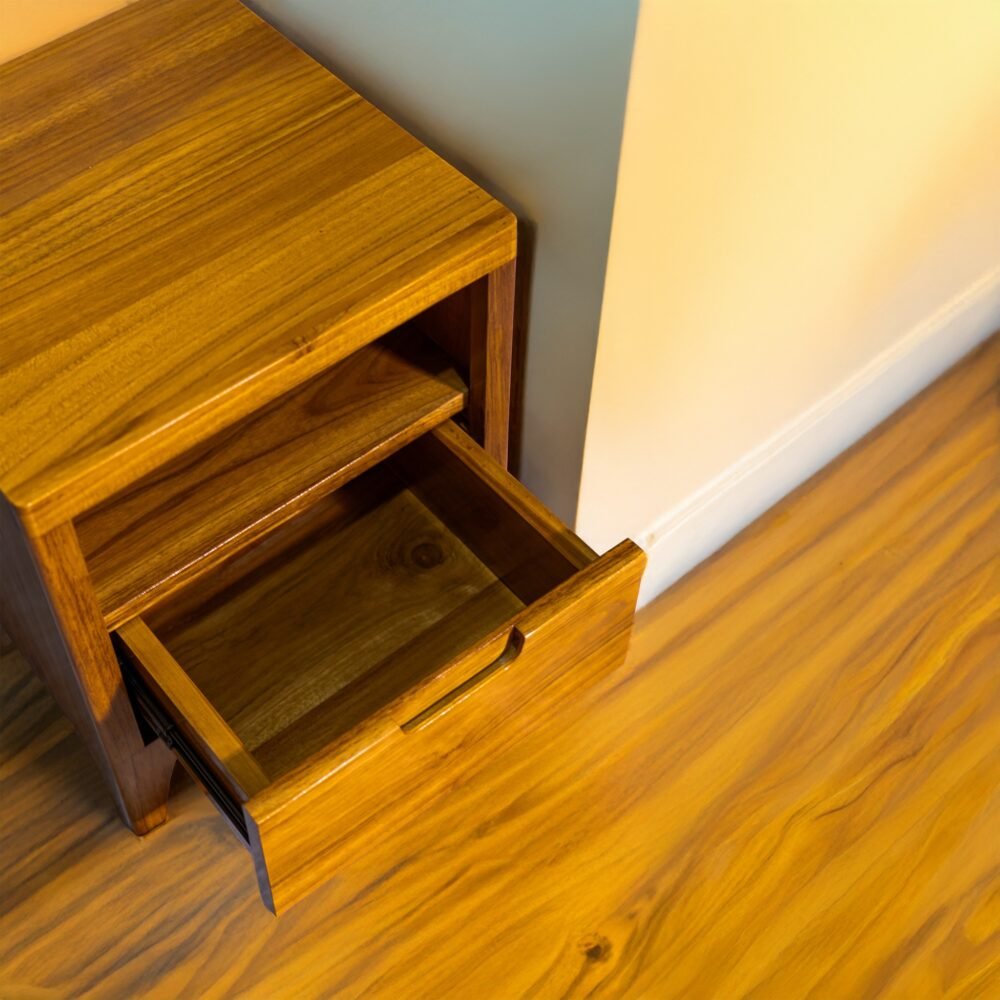 Elevate your space with the Elegant Teak Nightstand, featuring a single drawer, open shelf, and natural satin wood finish.
