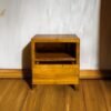 Elevate your space with the Elegant Teak Nightstand, featuring a single drawer, open shelf, and natural satin wood finish.