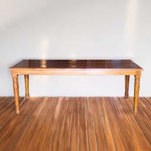 Experience timeless elegance with The Classic Hardwood Dining Table, crafted from durable teak wood with natural satin finish and spacious design.