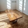 Enhance interiors with The Suar Live Edge Table, crafted from solid suar wood featuring unique live edge design and timeless durability.